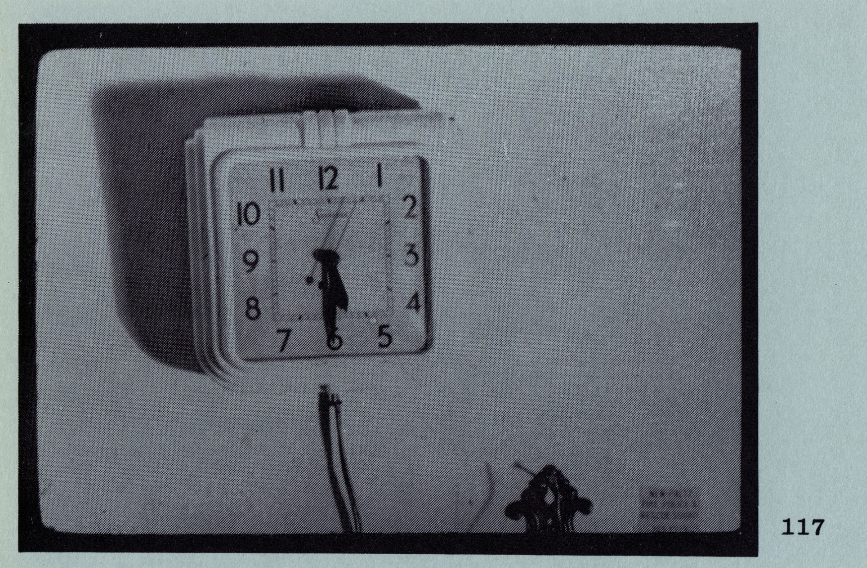 black and white image of a square clock