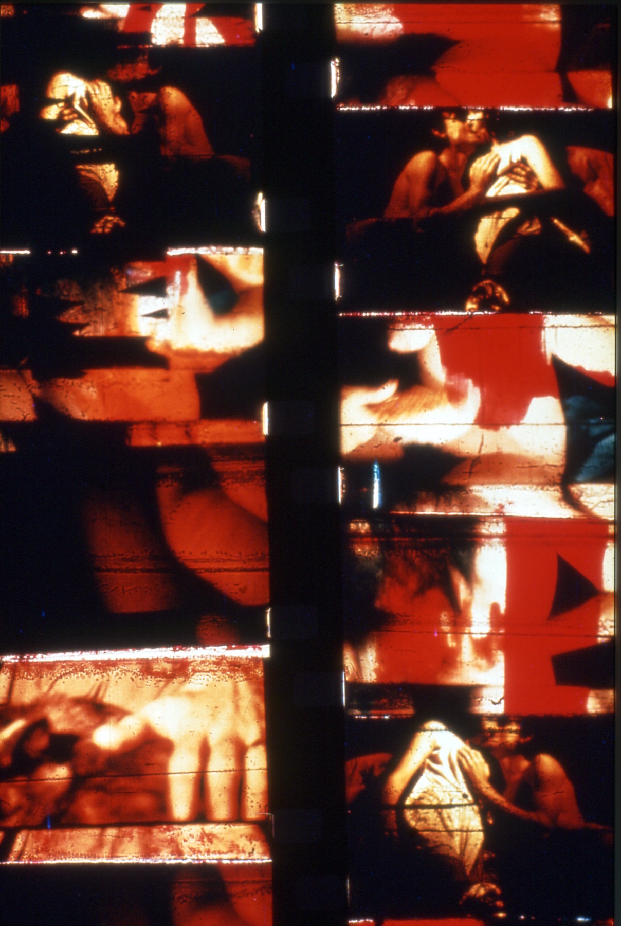 two film strips side by side, with a red filter; hands touching bodies