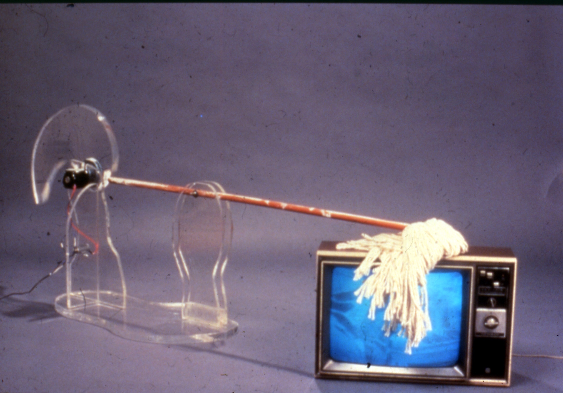 mop with motor repeatedly hitting television