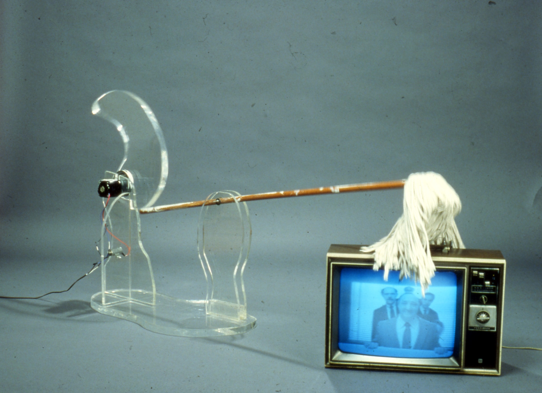 mop with motor repeatedly hitting television