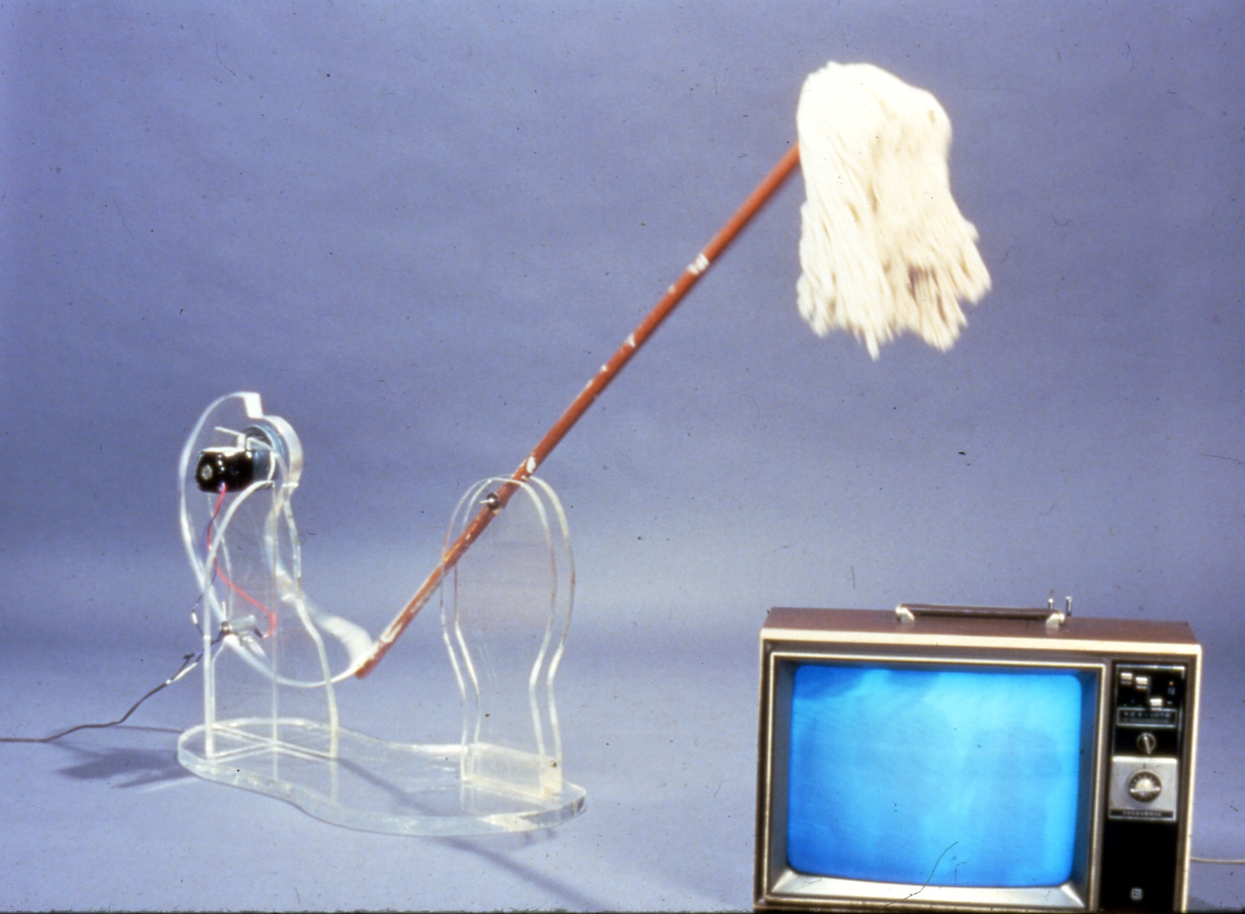 istallation shot of mop with moter repeatedly hitting television